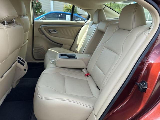 Photo of 2015 Ruby Red Metallic Tinted Clearcoat Ford Taurus