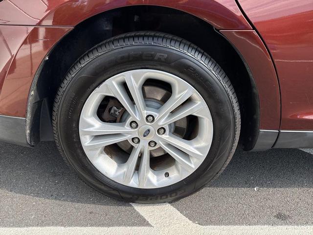 Photo of 2015 Ruby Red Metallic Tinted Clearcoat Ford Taurus