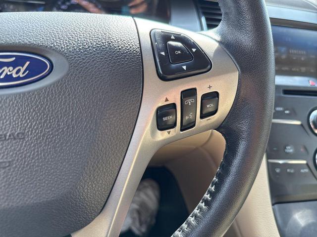 Photo of 2015 Ruby Red Metallic Tinted Clearcoat Ford Taurus