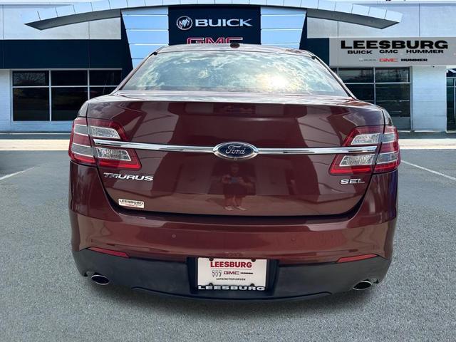 Photo of 2015 Ruby Red Metallic Tinted Clearcoat Ford Taurus