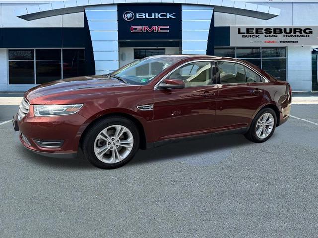 Photo of 2015 Ruby Red Metallic Tinted Clearcoat Ford Taurus