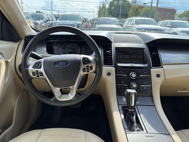 Photo of 2015 Ruby Red Metallic Tinted Clearcoat Ford Taurus
