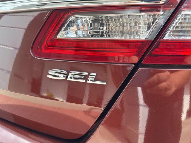 Photo of 2015 Ruby Red Metallic Tinted Clearcoat Ford Taurus