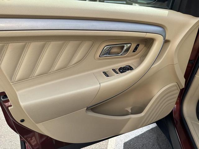 Photo of 2015 Ruby Red Metallic Tinted Clearcoat Ford Taurus