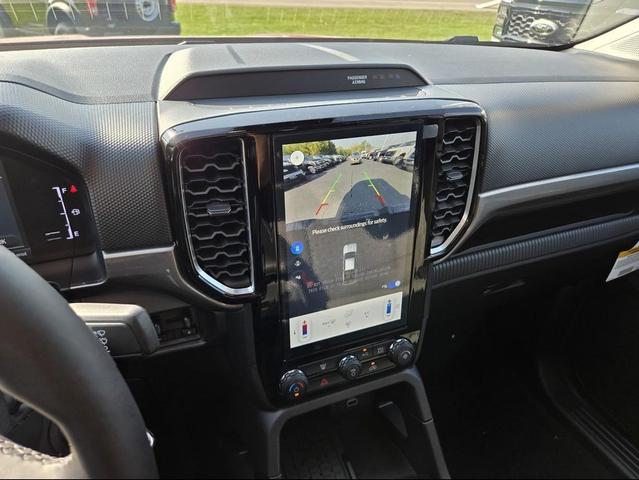Photo of 2025 Ruby Red Metallic Tinted Clearcoat Ford Ranger
