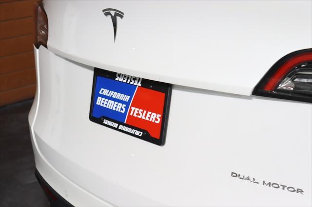 Photo of 2022 Pearl White Multi-Coat Tesla Model Y