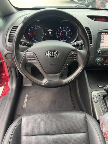 Photo of 2016 Crimson Red Metallic Kia Forte