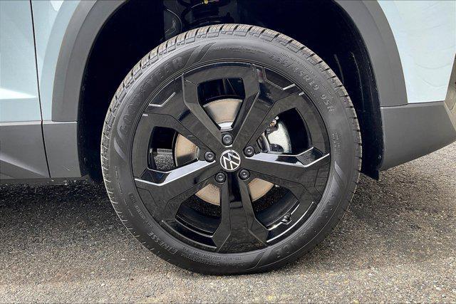 Photo of 2025 Monument Gray w/Deep Black Roof Volkswagen Taos