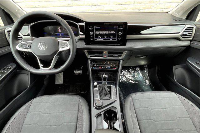 Photo of 2025 Monument Gray w/Deep Black Roof Volkswagen Taos