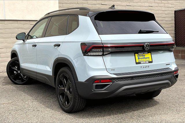 Photo of 2025 Monument Gray w/Deep Black Roof Volkswagen Taos