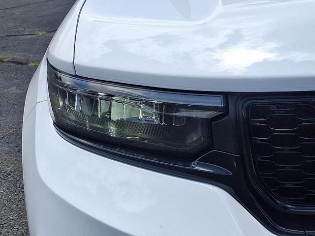 Photo of 2025 Bright White Clearcoat Jeep Grand Cherokee
