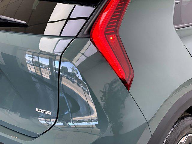 Photo of 2025 Cityscape Green Kia Niro Plug-In Hybrid