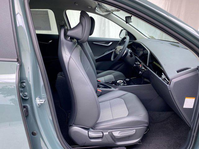 Photo of 2025 Cityscape Green Kia Niro Plug-In Hybrid