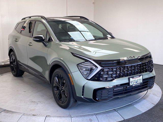 Photo of 2025 Jungle Green Kia Sportage