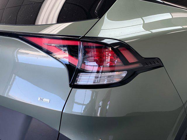 Photo of 2025 Jungle Green Kia Sportage