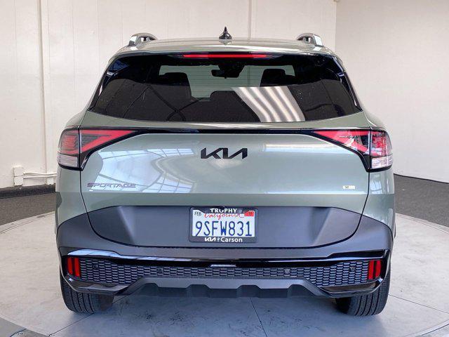 Photo of 2025 Jungle Green Kia Sportage