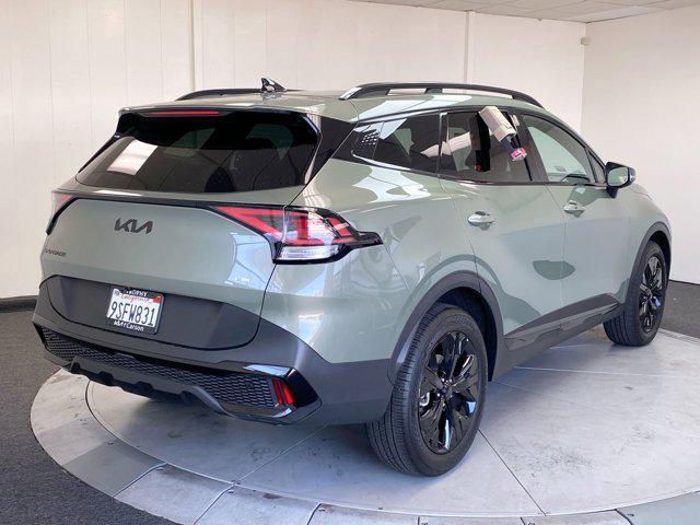 Photo of 2025 Jungle Green Kia Sportage