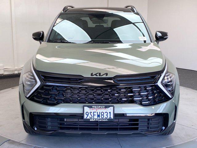 Photo of 2025 Jungle Green Kia Sportage