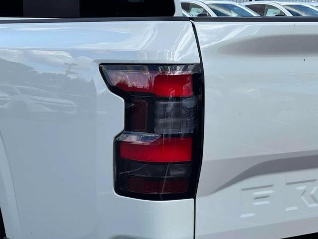Photo of 2025 Glacier White Nissan Frontier
