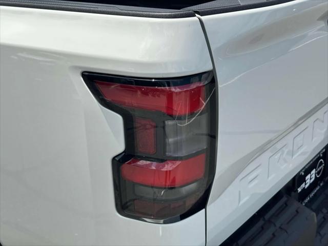 Photo of 2025 Glacier White Nissan Frontier