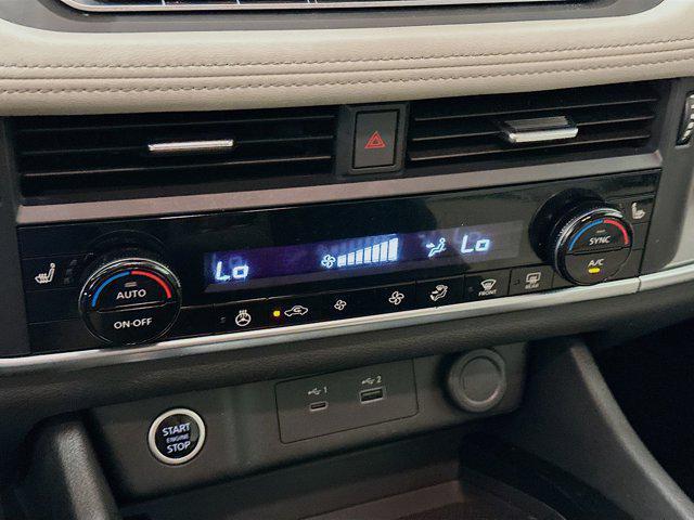 Photo of 2023 Pearl White Tricoat Nissan Rogue