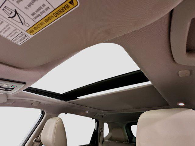 Photo of 2023 Pearl White Tricoat Nissan Rogue