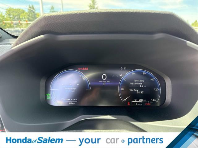 Photo of 2025 Wind Chill Pearl/Midnight Black Metallic Toyota RAV4 Hybrid