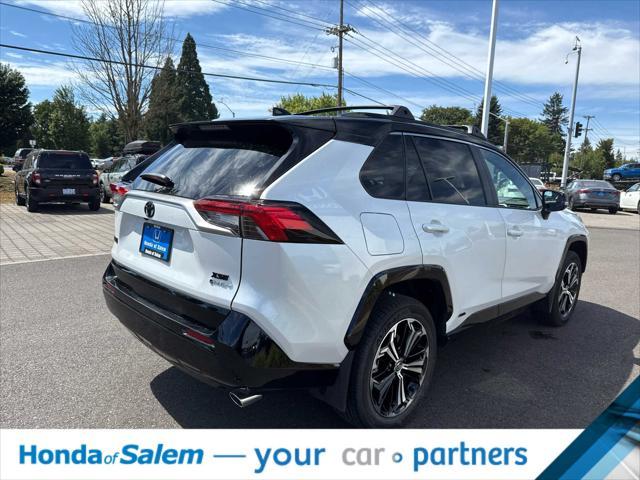 Photo of 2025 Wind Chill Pearl/Midnight Black Metallic Toyota RAV4 Hybrid