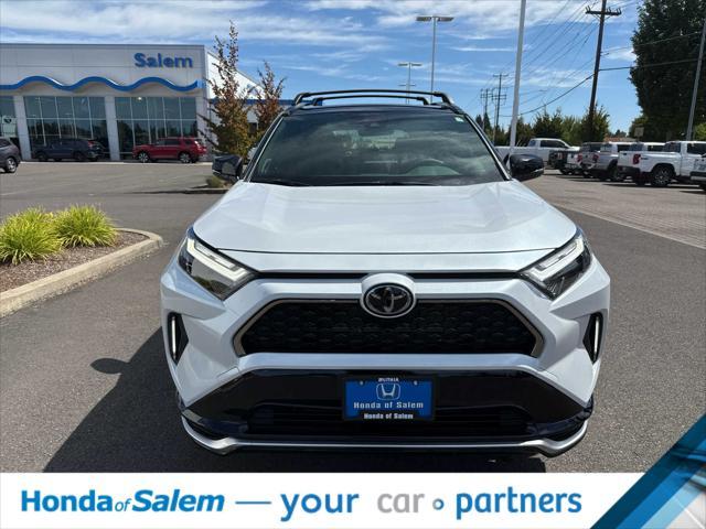 Photo of 2025 Wind Chill Pearl/Midnight Black Metallic Toyota RAV4 Hybrid