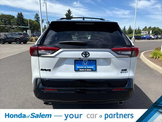 Photo of 2025 Wind Chill Pearl/Midnight Black Metallic Toyota RAV4 Hybrid