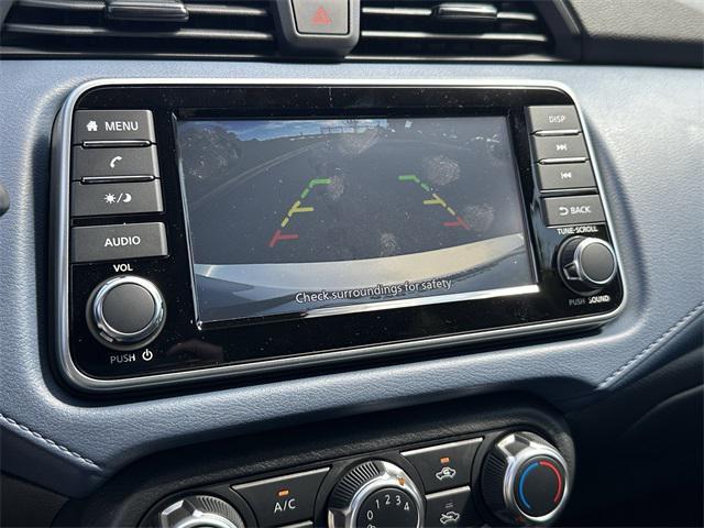 Photo of 2025 Aspen White Tricoat Nissan Versa