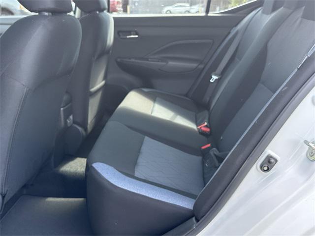 Photo of 2025 Aspen White Tricoat Nissan Versa
