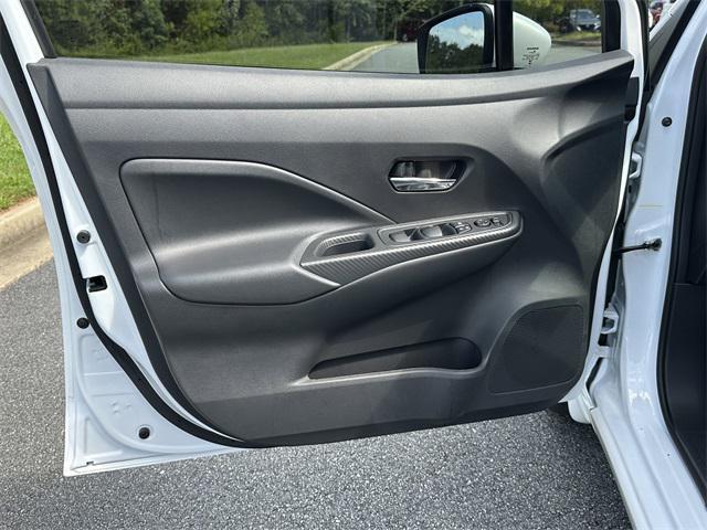 Photo of 2025 Aspen White Tricoat Nissan Versa