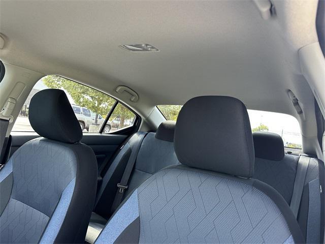 Photo of 2025 Aspen White Tricoat Nissan Versa