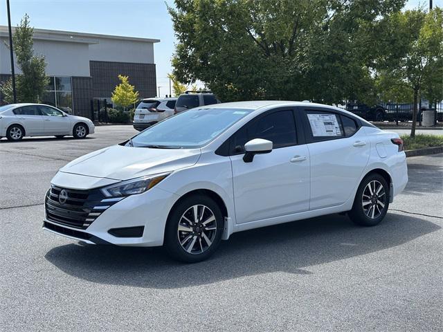 Photo of 2025 Aspen White Tricoat Nissan Versa