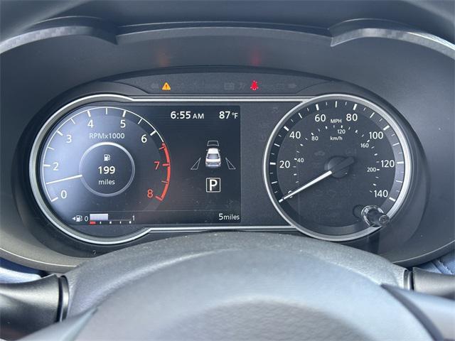 Photo of 2025 Aspen White Tricoat Nissan Versa