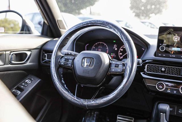 Photo of 2025 Boost Blue Pearl Honda Civic