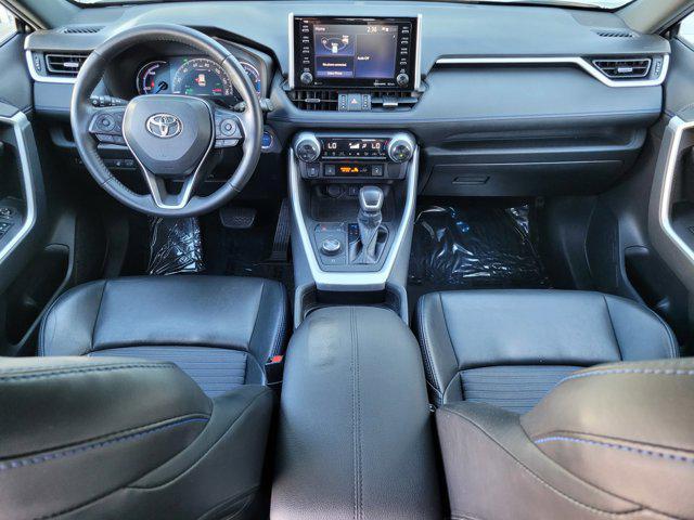 Photo of 2021 Blizzard Pearl/Midnight Black Metallic Toyota RAV4 Hybrid
