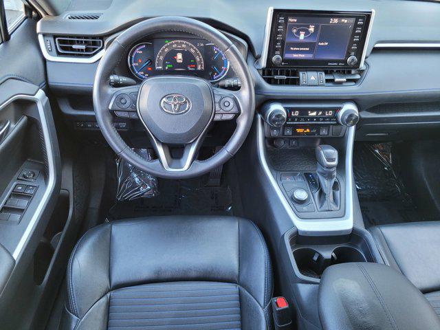 Photo of 2021 Blizzard Pearl/Midnight Black Metallic Toyota RAV4 Hybrid