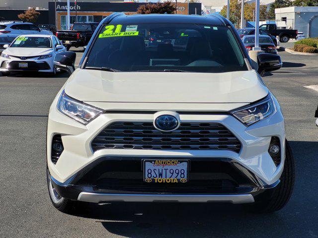 Photo of 2021 Blizzard Pearl/Midnight Black Metallic Toyota RAV4 Hybrid