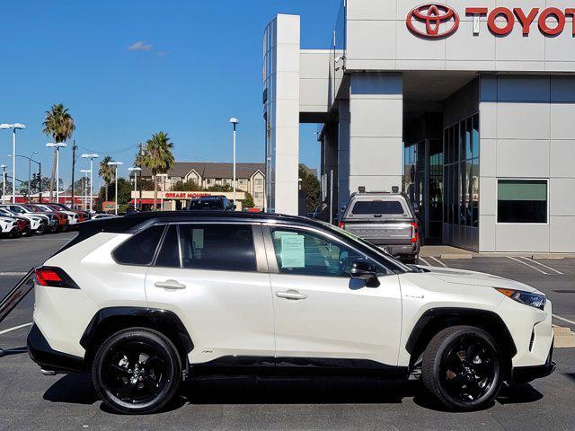 Photo of 2021 Blizzard Pearl/Midnight Black Metallic Toyota RAV4 Hybrid