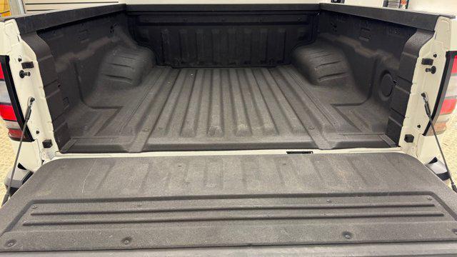 Photo of 2023 Glacier White Nissan Frontier