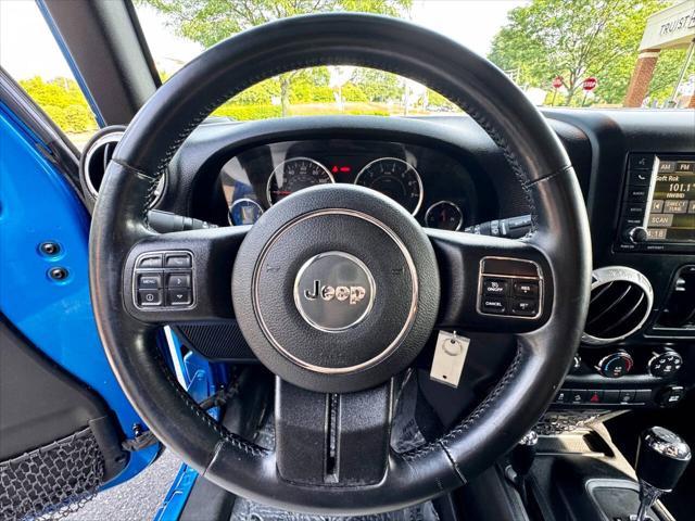 Photo of 2015 Hydro Blue Pearl Jeep Wrangler Unlimited