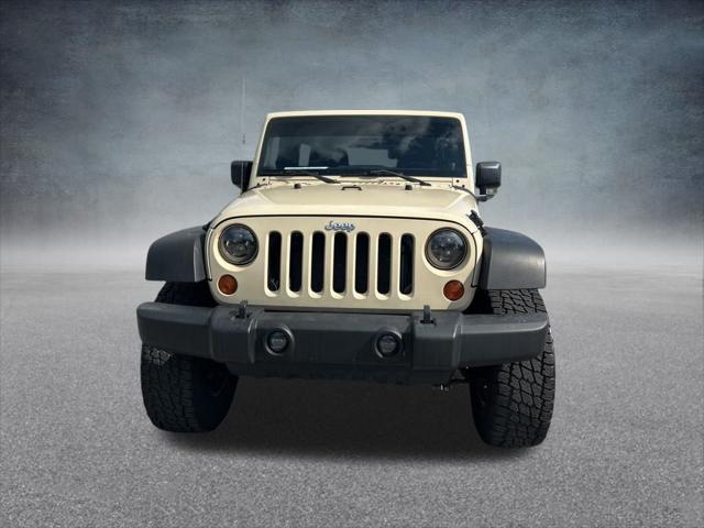 Photo of 2011 Sahara Tan Clearcoat Jeep Wrangler Unlimited