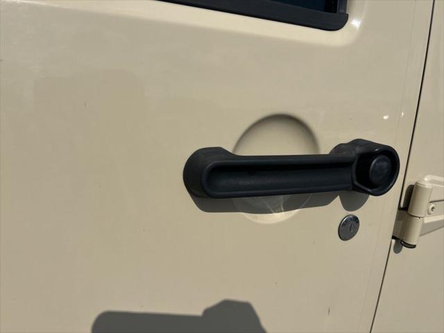 Photo of 2011 Sahara Tan Clearcoat Jeep Wrangler Unlimited