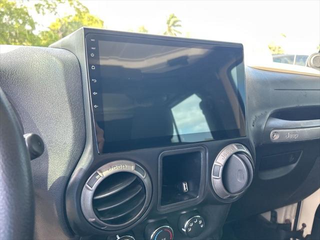 Photo of 2011 Sahara Tan Clearcoat Jeep Wrangler Unlimited