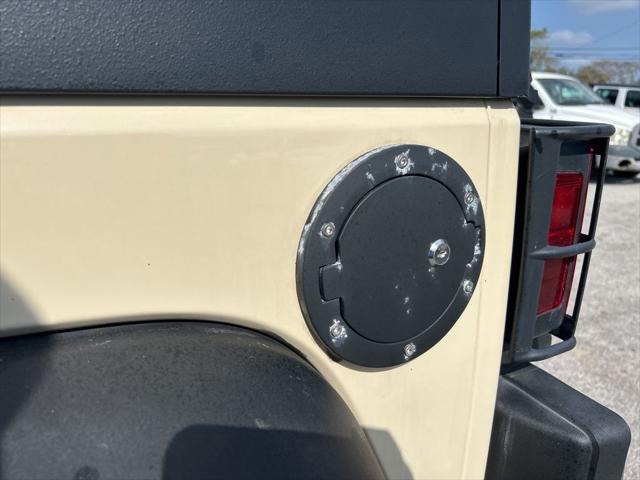 Photo of 2011 Sahara Tan Clearcoat Jeep Wrangler Unlimited