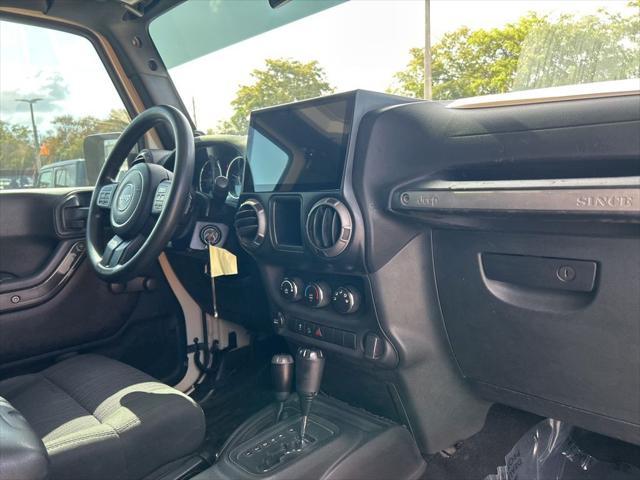 Photo of 2011 Sahara Tan Clearcoat Jeep Wrangler Unlimited