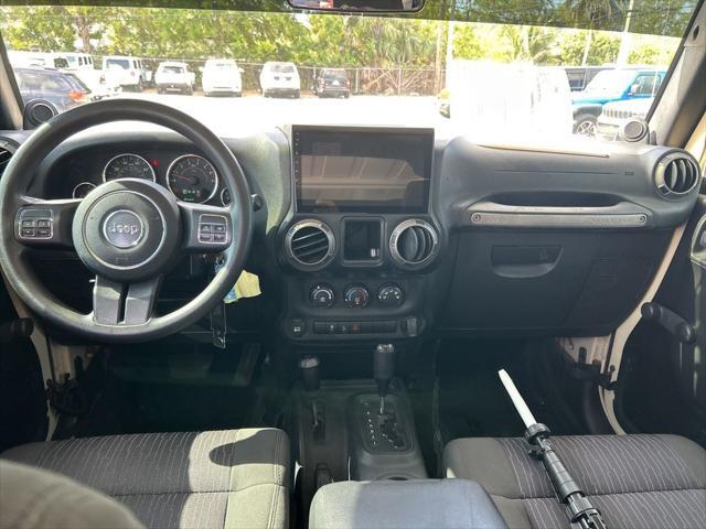 Photo of 2011 Sahara Tan Clearcoat Jeep Wrangler Unlimited