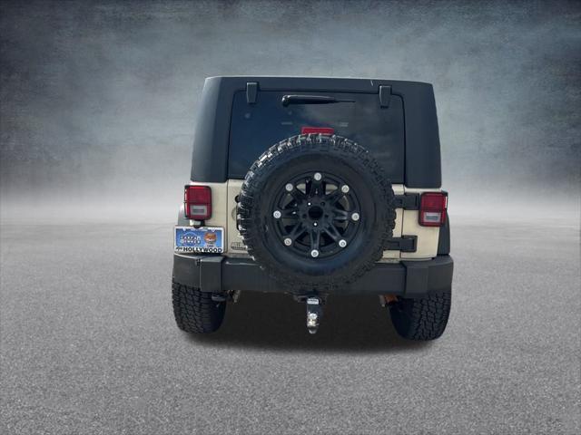 Photo of 2011 Sahara Tan Clearcoat Jeep Wrangler Unlimited